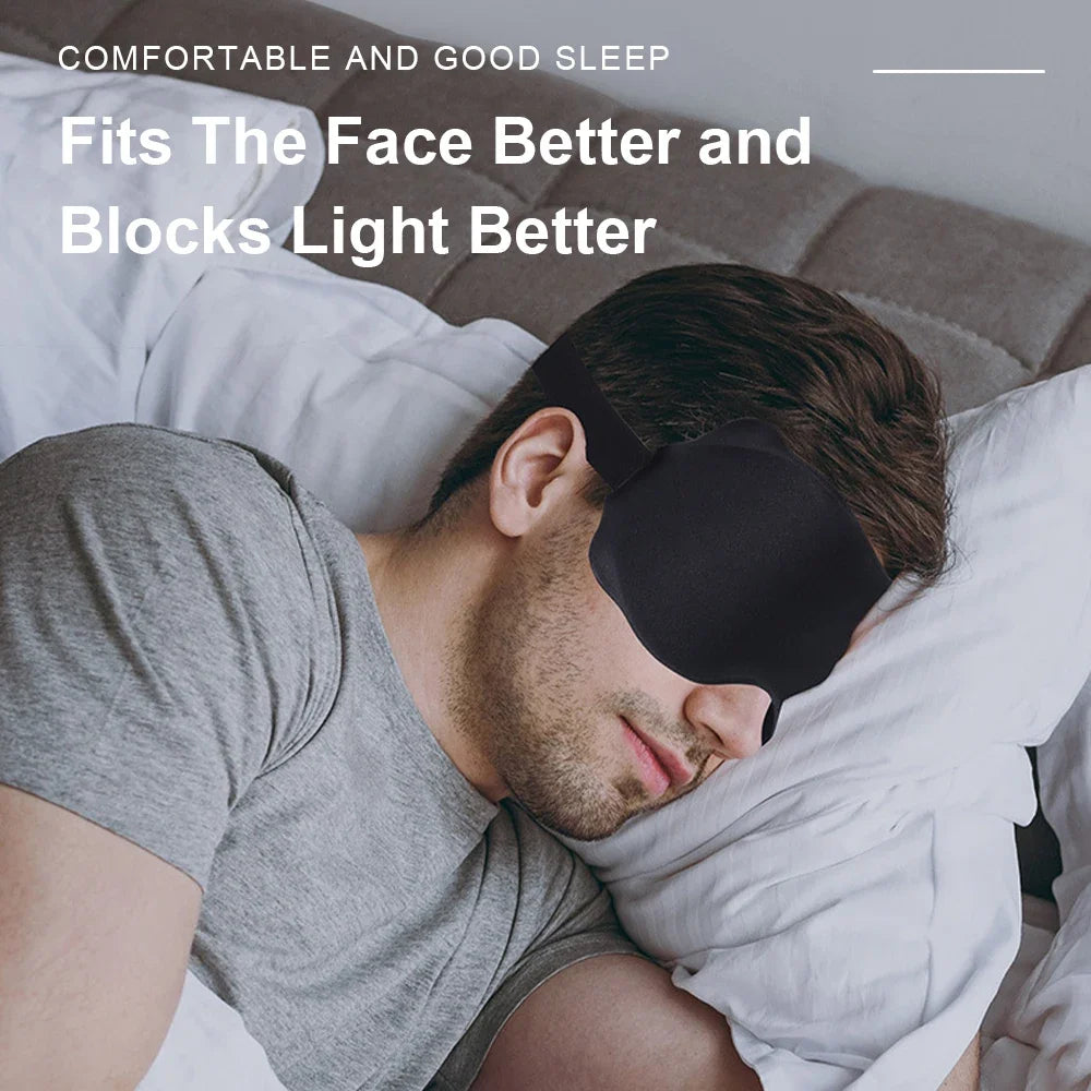 Man wearing a black sleep mask in bed with text about comfort and light blocking.